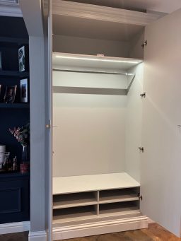 Beautiful downstairs fitted wardrobe, hand-crafted to home coats and shoes.  Moisture resistant MDF with shaker-style paneled doors. Cornice and Skirting to compliment existing decorations.